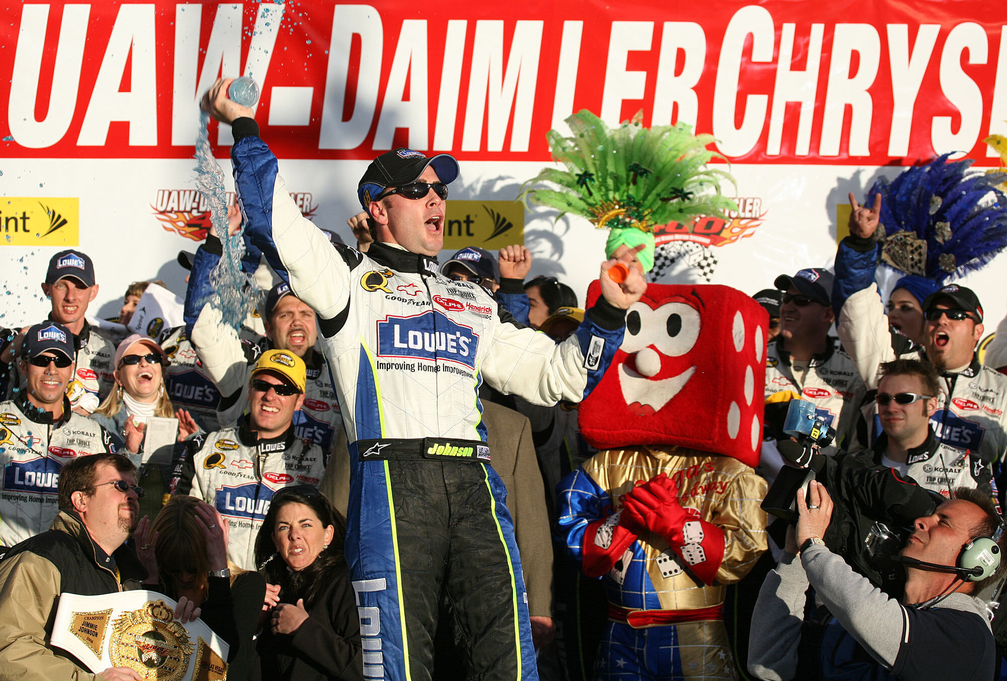 FILE - Jimmie Johnson celebrates his win in victory lane at NASCAR's UAW-DaimlerChrysler 400 at the Las Vegas Motor Speedway, March 12, 2006. (AP Photo/Eric Jamison, File)