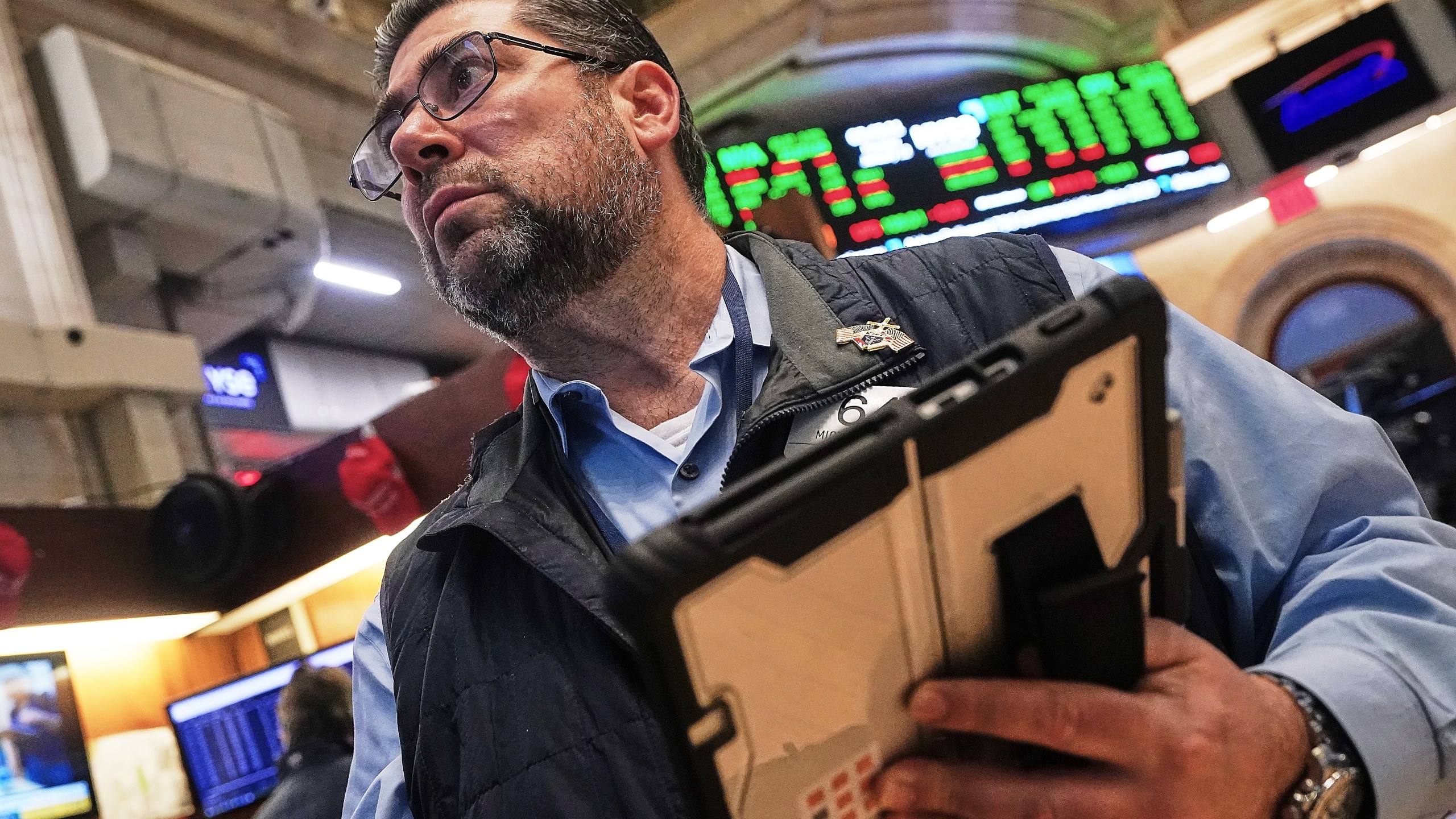 Trader Michael Capolino works on the floor of the New York Stock Exchange, Monday, Jan. 12, 2026. (AP Photo/Richard Drew)