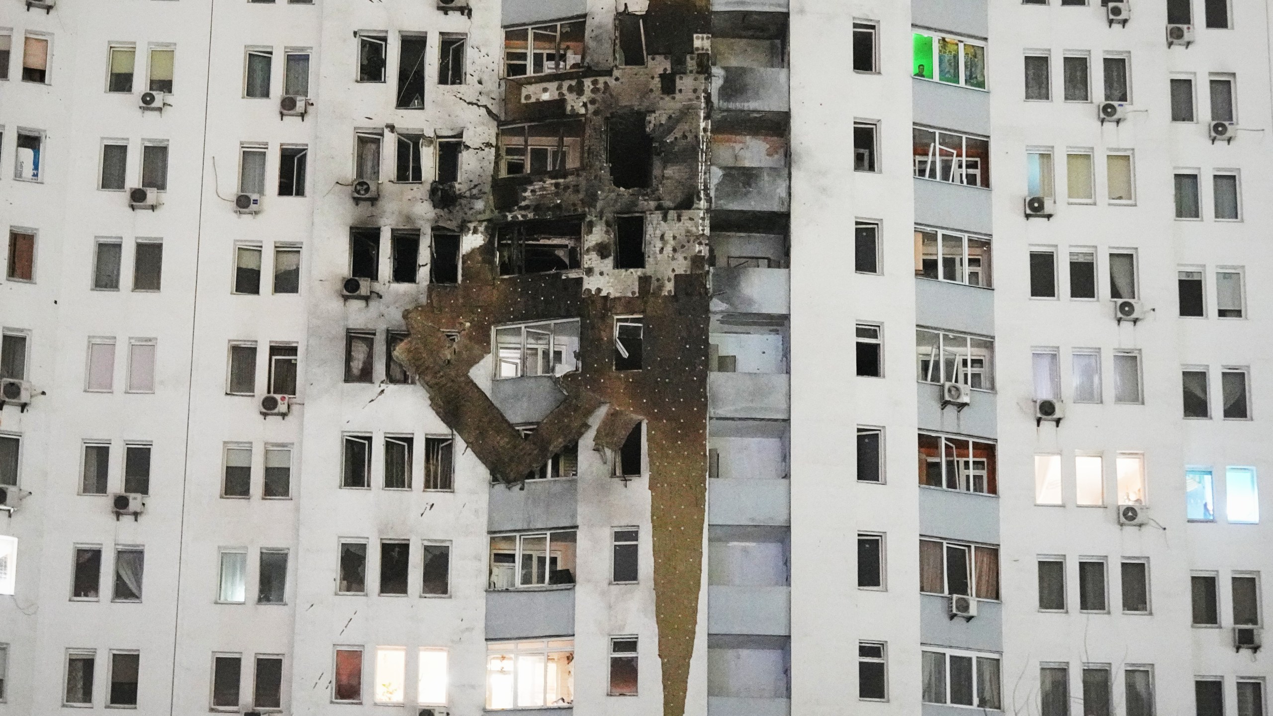 A residential building is seen damaged after a Russian strike in Kyiv, Ukraine, Friday, Jan. 9, 2026. (AP Photo/Efrem Lukatsky)