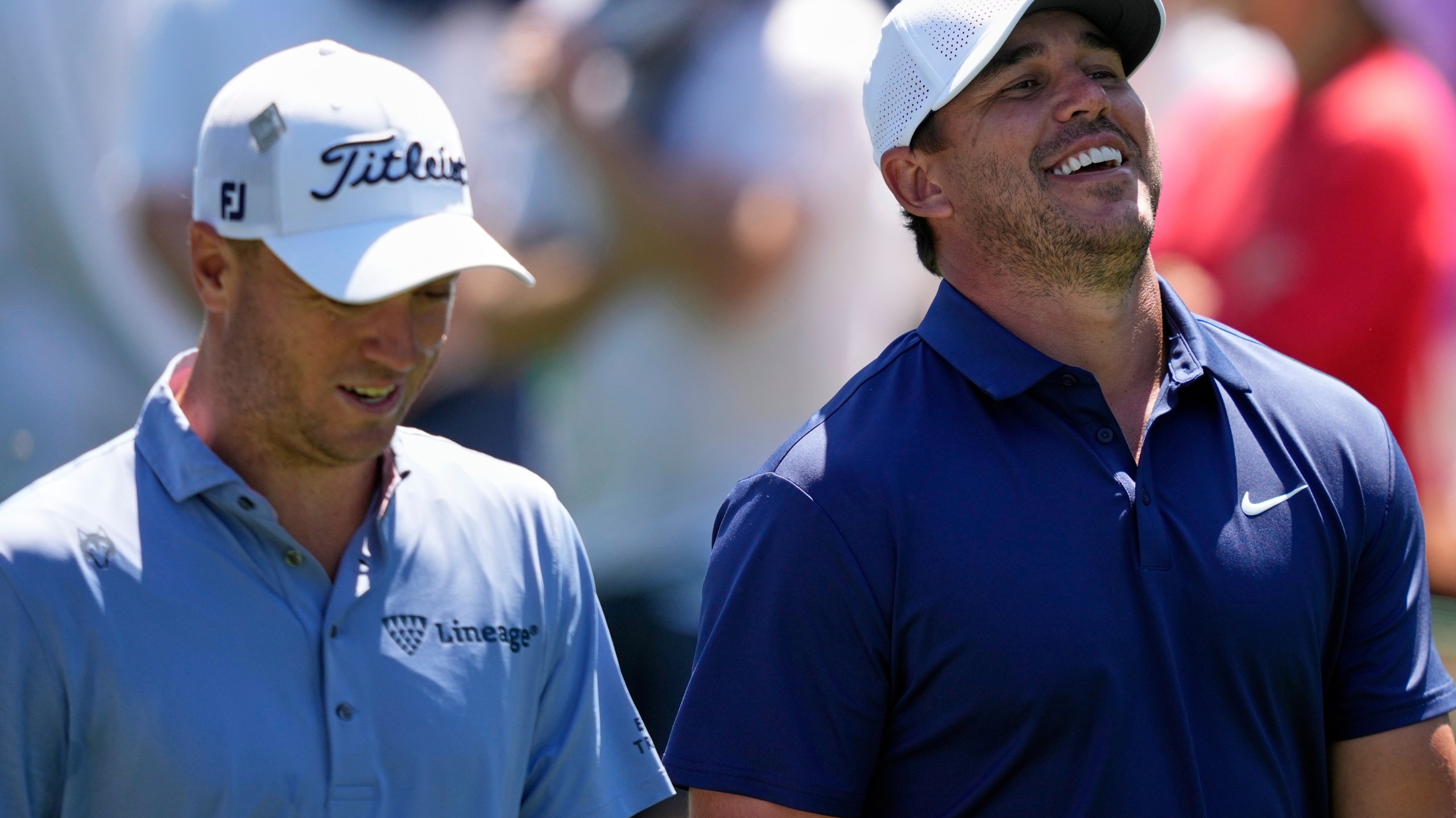 FILE - Brooks Koepka laughs while talking with Justin Thomas, left, on the 15th fairway during a practice round at the Masters golf tournament, Tuesday, April 8, 2025, in Augusta, Ga. (AP Photo/Matt Slocum, File)