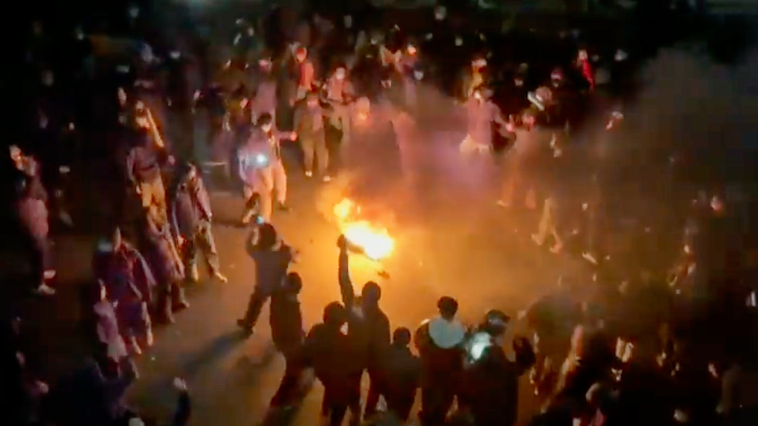 In this frame grab from footage circulating on social media shows protesters dancing and cheering around a bonfire as they take to the streets despite an intensifying crackdown as the Islamic Republic remains cut off from the rest of the world, in Tehran, Iran, Friday, Jan. 9, 2026.(UGC via AP)