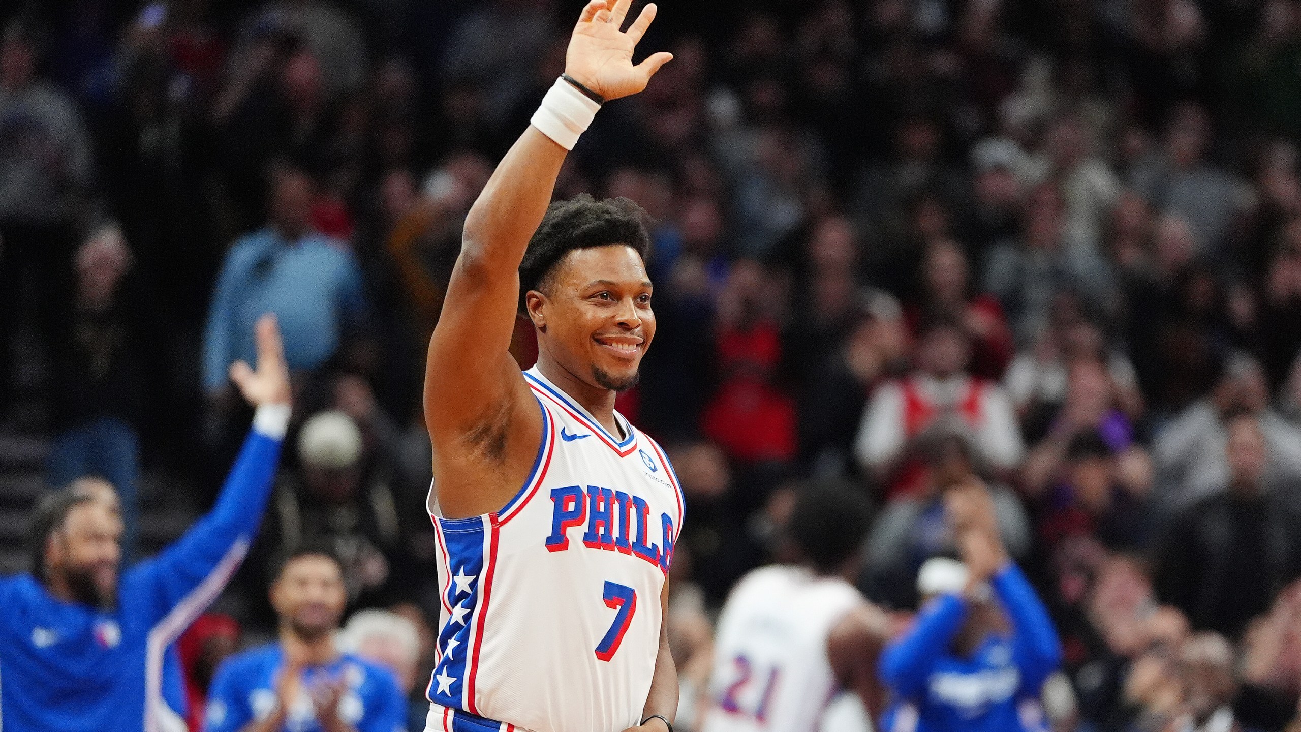 Philadelphia 76ers guard Kyle Lowry (7) acknowledges the fans as he is brought in during the final minutes of an NBA basketball game against his former team, the Toronto Raptors, in Toronto, Monday, Jan. 12, 2026. (Frank Gunn/The Canadian Press via AP)