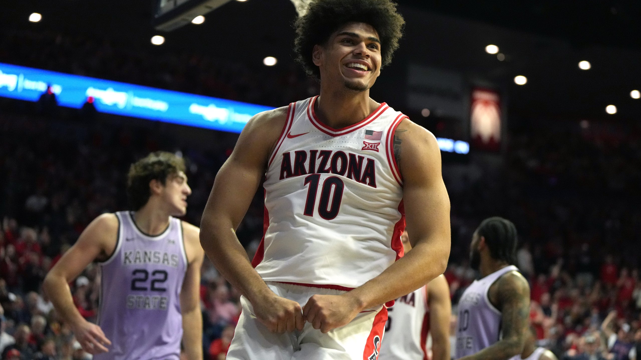 Arizona forward Koa Peat reacts after scoring against Kansas State during the second half of an NCAA college basketball game, Wednesday, Jan. 7, 2026, in Tucson, Ariz. (AP Photo/Rick Scuteri)