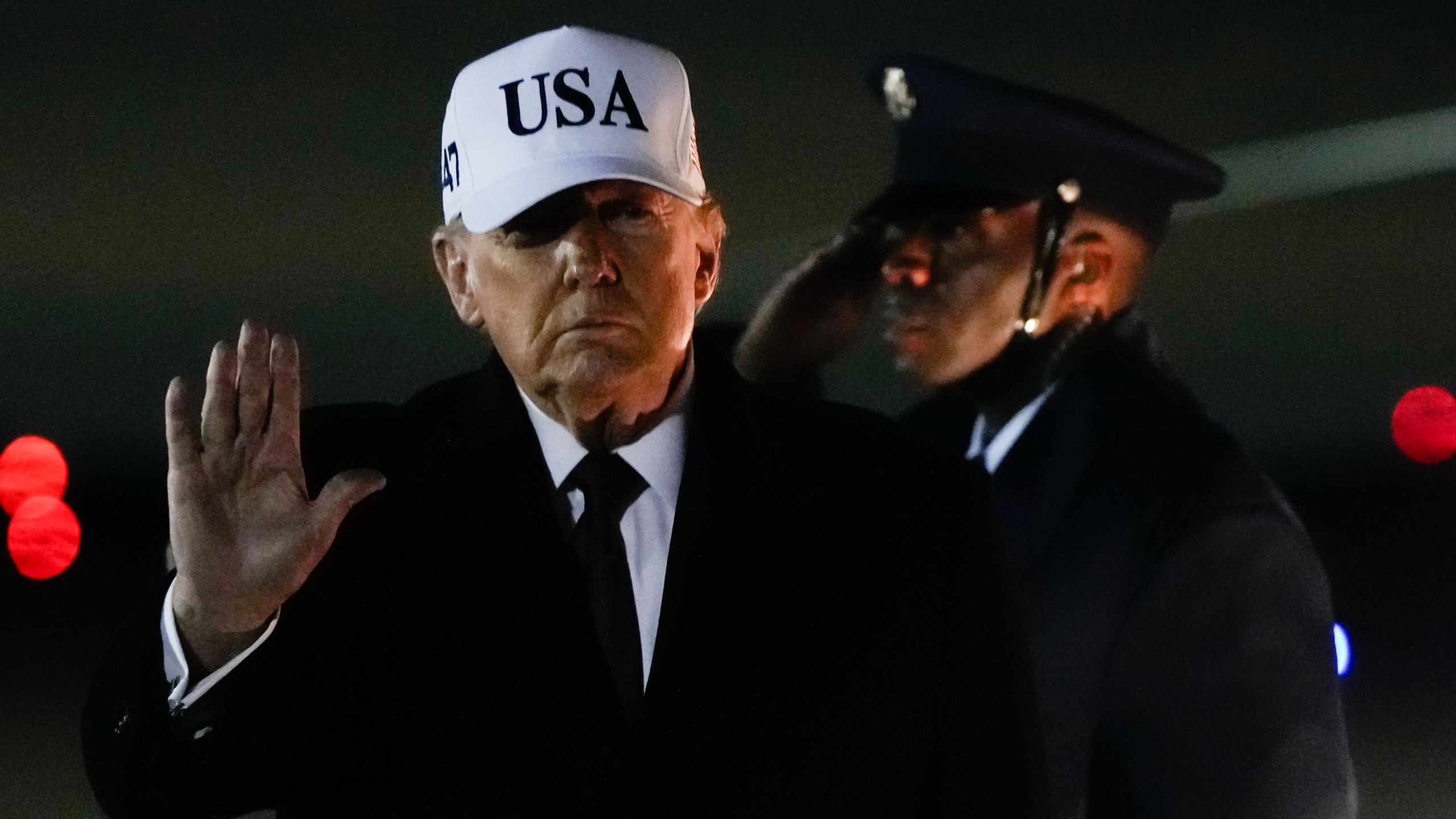 President Donald Trump waves after arriving on Air Force One from Florida, Sunday, Jan. 11, 2026, at Joint Base Andrews, Md. (AP Photo/Julia Demaree Nikhinson)