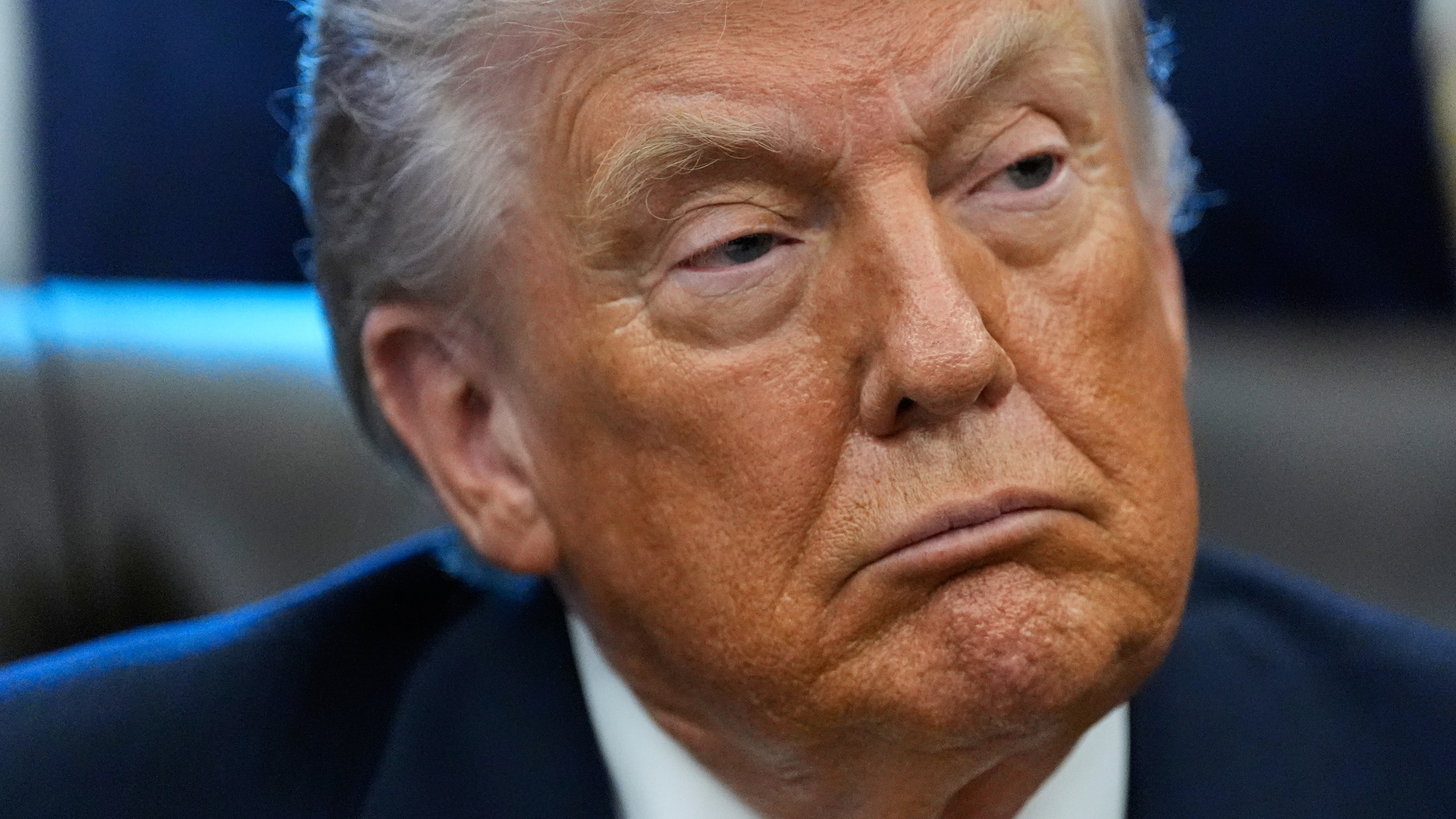 President Donald Trump listens in the Oval Office of the White House, Wednesday, Jan. 14, 2026, in Washington. (AP Photo/Alex Brandon)