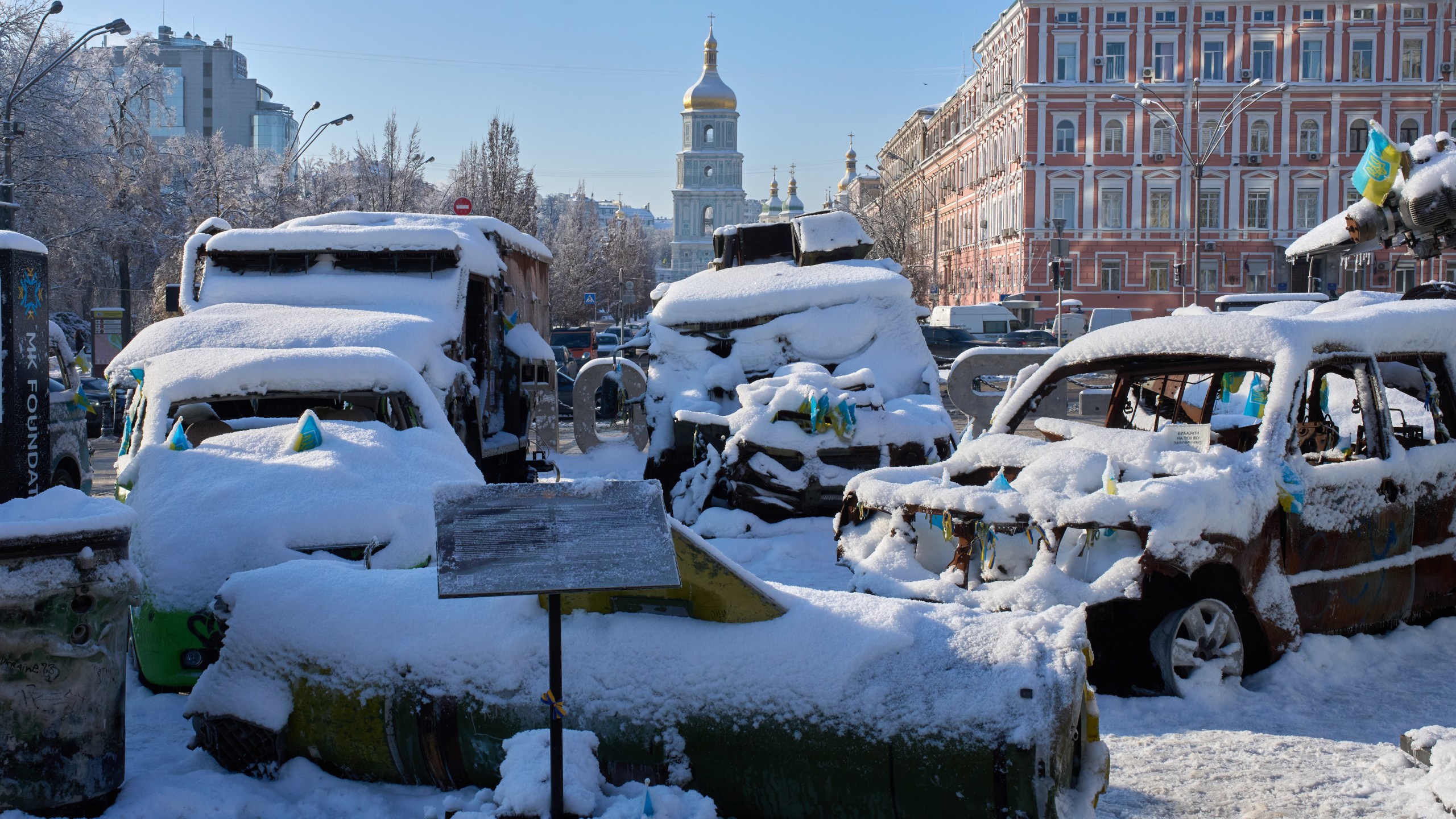 Snow covered, damaged Russian military vehicles are on display in downtown Kyiv, Ukraine, Friday, Jan. 16, 2026. (AP Photo/Efrem Lukatsky)