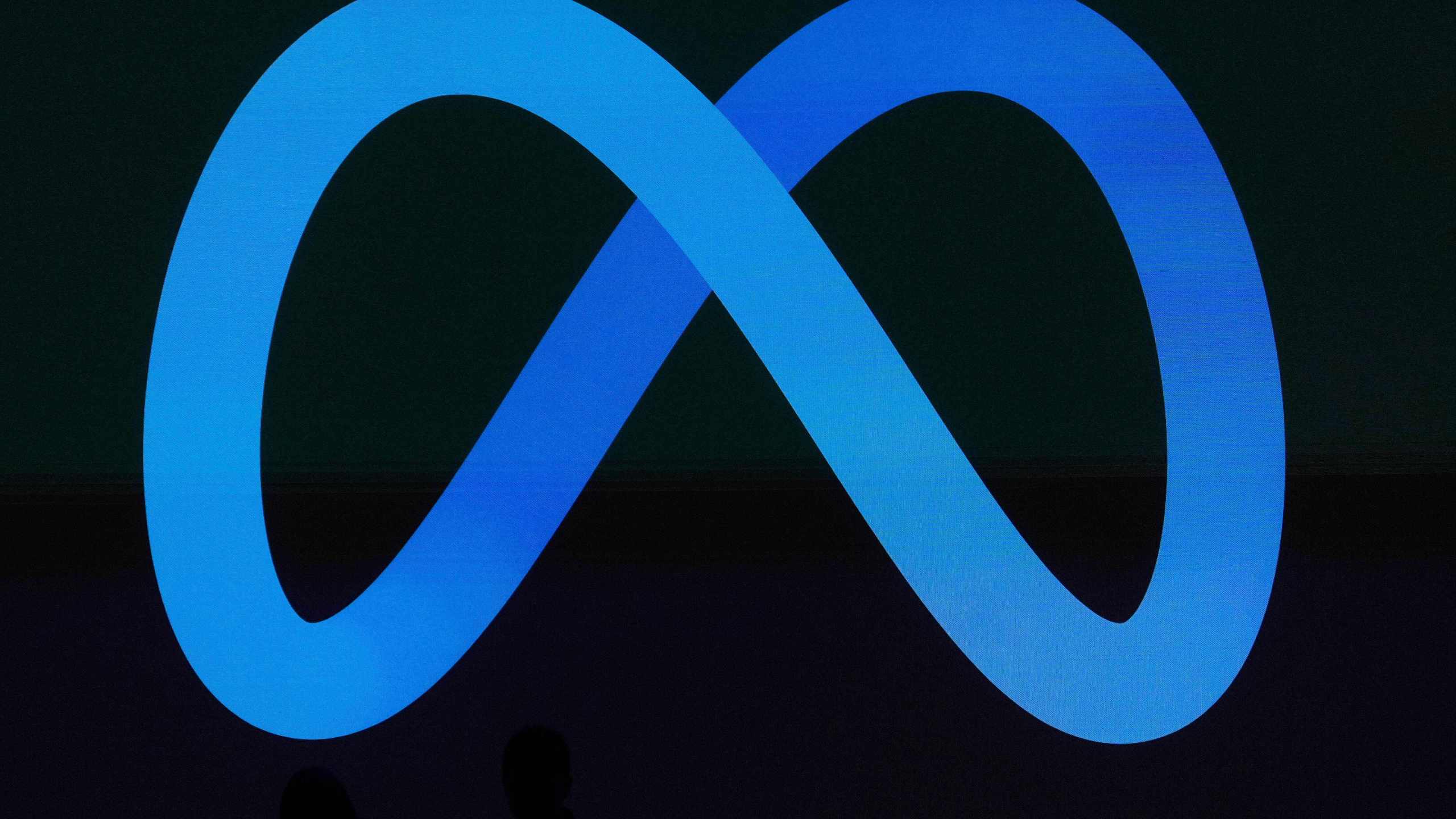 FILE -A Meta logo is shown on a video screen at LlamaCon 2025, an AI developer conference, in Menlo Park, Calif., April 29, 2025. (AP Photo/Jeff Chiu, File)