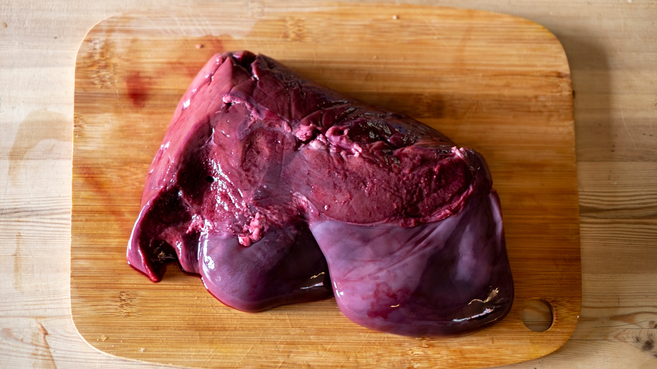 An image of beef liver on a cutting board