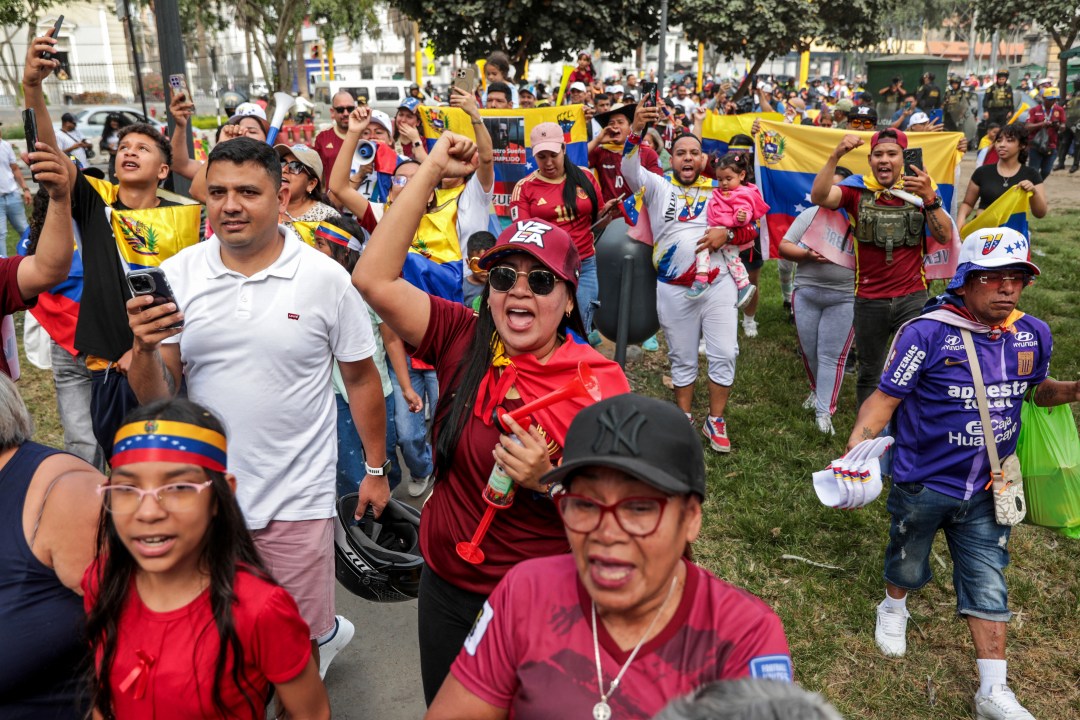 Venezuelans living in Peru celebrate at the Miguel de Cervantes park, near the Venezuelan Embassy in Lima on January 3, 2026, after US forces captured Venezuelan leader Nicolas Maduro. President Donald Trump said Saturday that US forces had captured Venezuela's leader Nicolas Maduro after bombing the capital Caracas and other cities in a dramatic climax to a months-long standoff between Trump and his Venezuelan arch-foe.