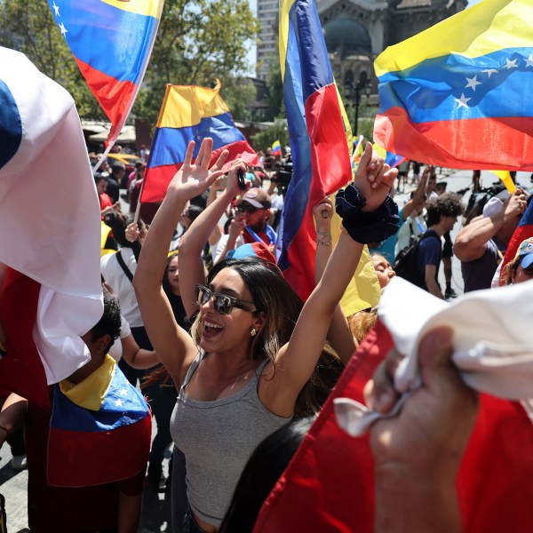 Venezuelans wave flags and dance in the streets of Chile as they celebrate the capture of Venezuelan leader Nicolas Maduro
