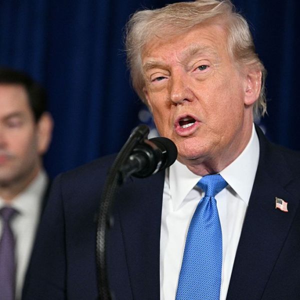 President Trump speaks to the press as Secretary of State Marco Rubio looks on