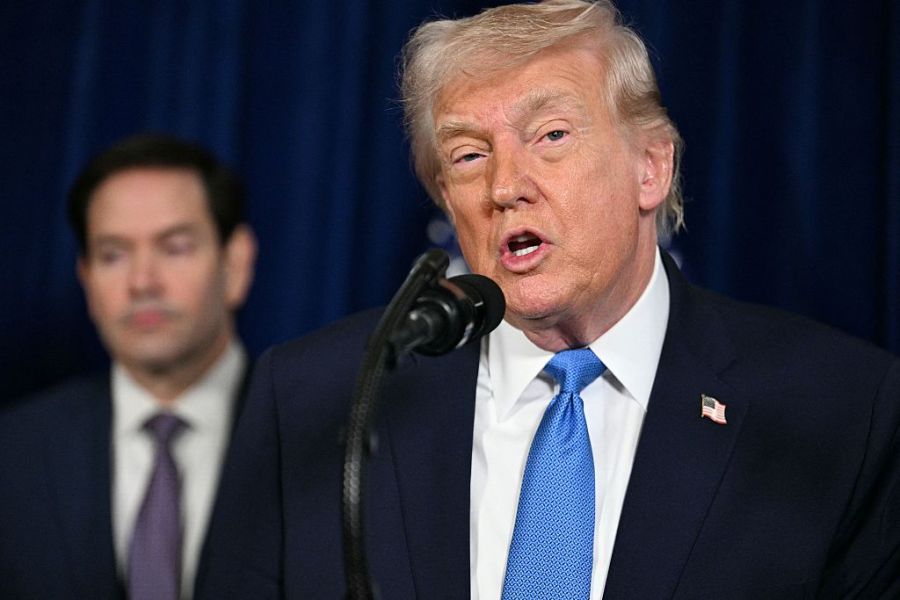 President Trump speaks to the press as Secretary of State Marco Rubio looks on
