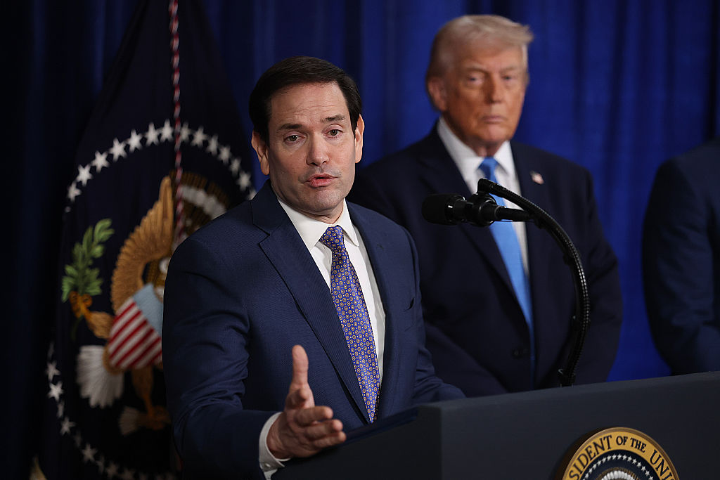 Secretary of State Marco Rubio speaks while President Donald Trump watches during a news conference
