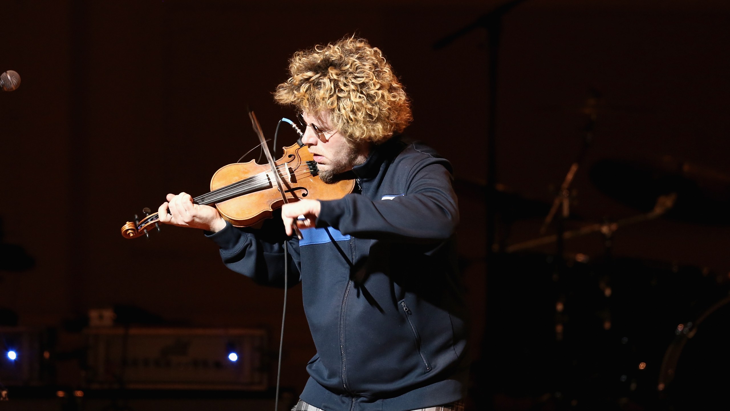 Musician Ashley MacIsaac performs on stage