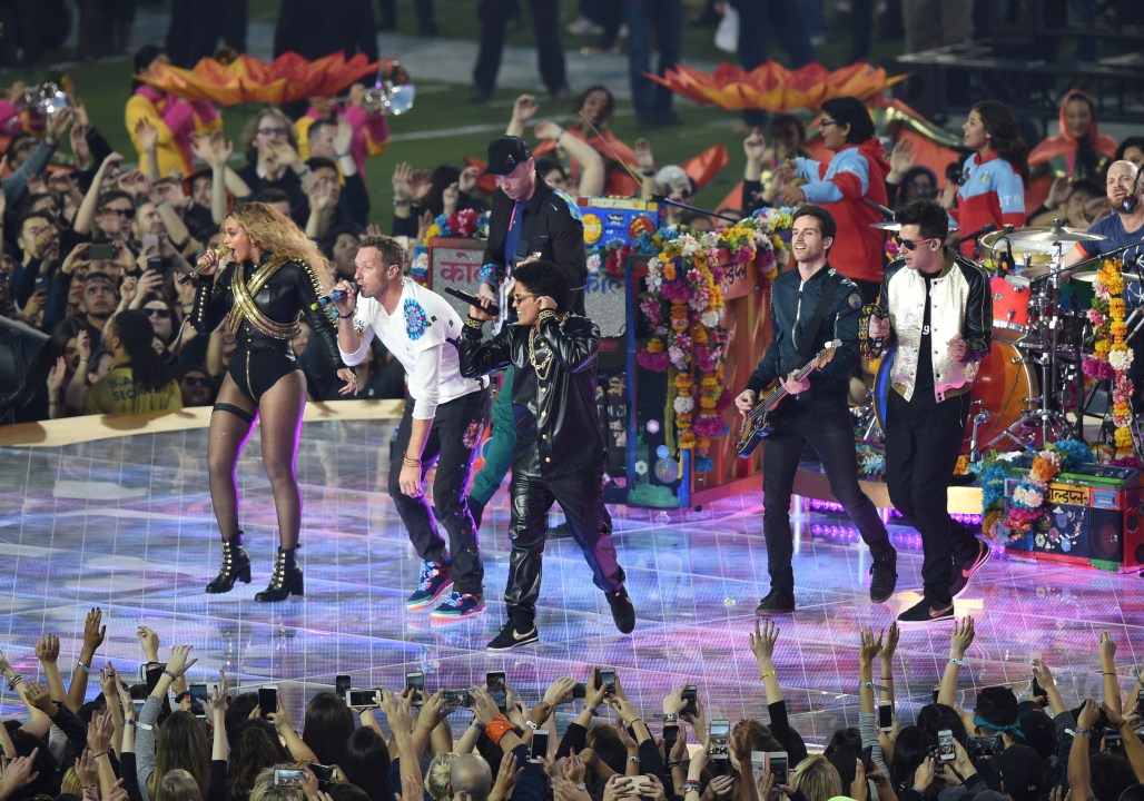 Chris Martin and Coldplay, Beyonce and Bruno Mars perform on stage during halftime of Super Bowl 50 