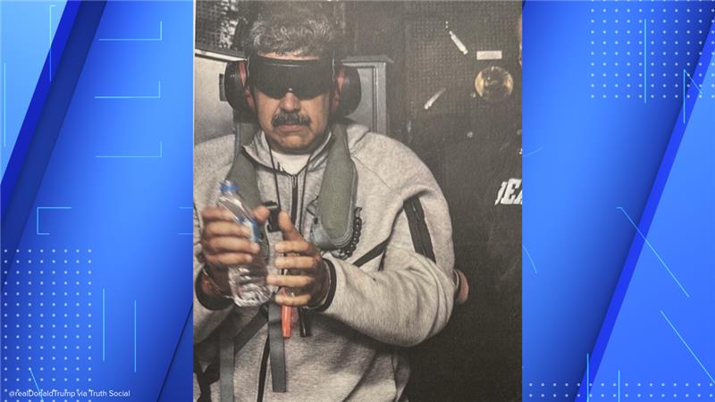 Nicolás Maduro blindfolded holding a water bottle